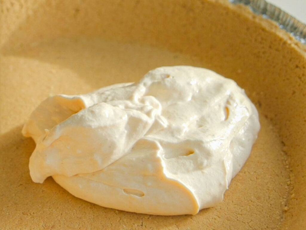 adding filling to graham cracker crust